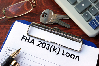 A clipboard displaying an FHA 203k renovation loan.